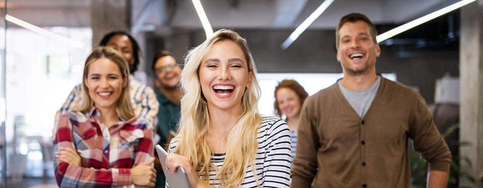 Happy Gen Z employees in an office