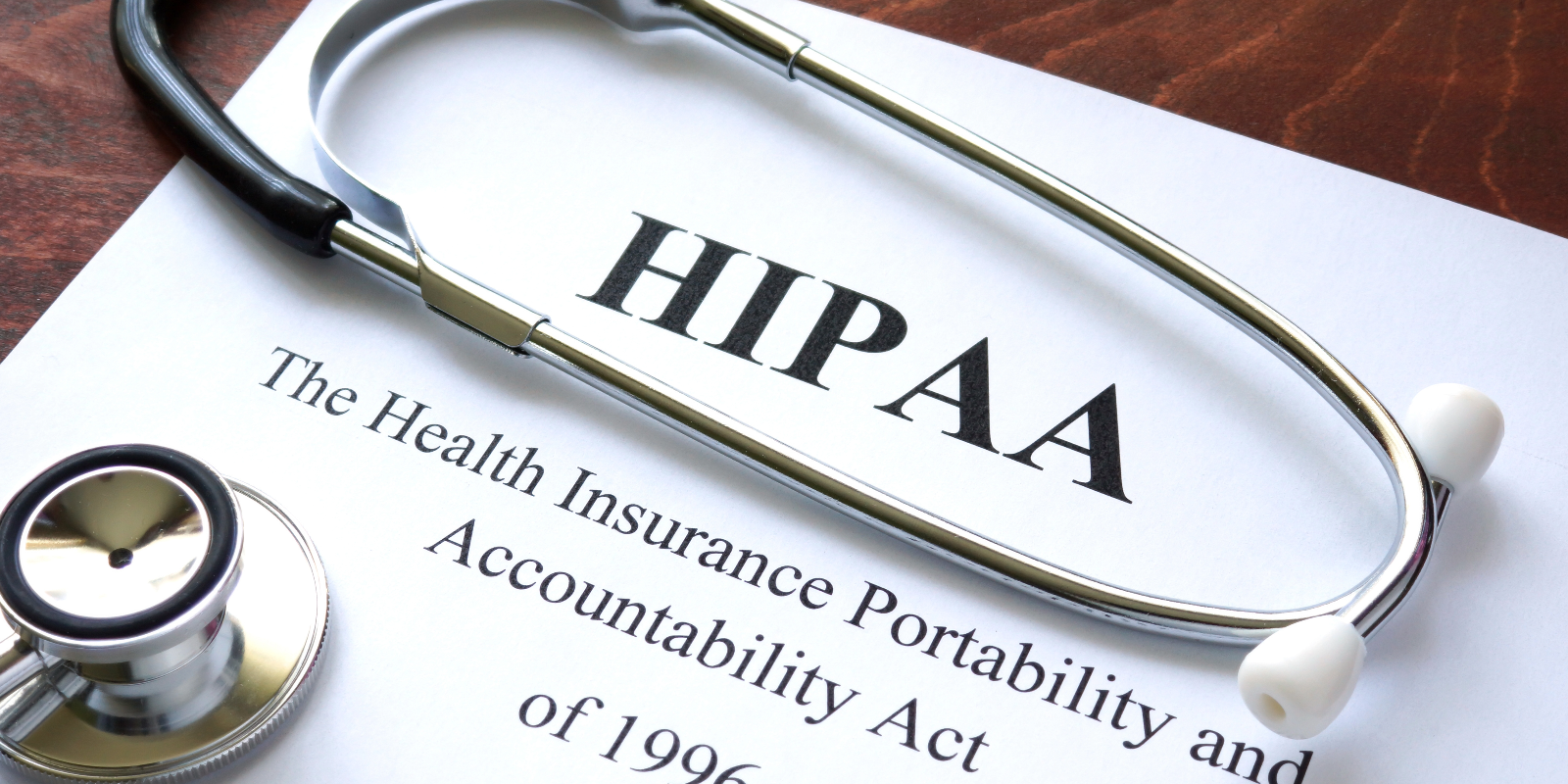 stethoscope on a paper with the words Health Insurance Portability and Accountability Act (HIPAA) of 1996